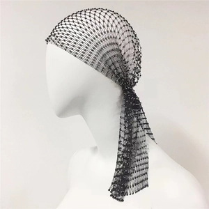 Macro view of black elastic mesh headwrap with shiny rhinestones and beaded net texture