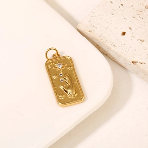 Detailed 14K gold-filled rectangular pendant with carved palm moon and star patterns
