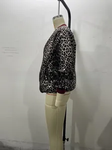 Detail of the elastic ribbed cuffs and leopard print fabric on a reversible bomber jacket
