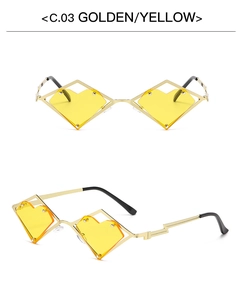 Detail view of heart-shaped geometric sunglasses with golden metal frame and yellow lens