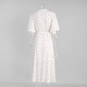 Detail of the back tie closure and floral print on white cotton puff sleeve dress