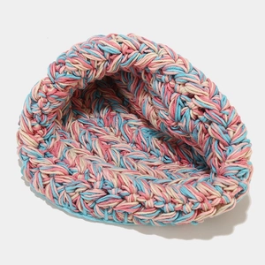 Close-up detail of mixed color chunky knit wool bucket hat with thick textured grain