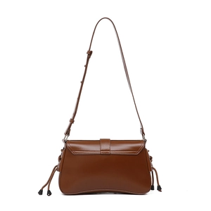 Brown leather baguette bag with adjustable long shoulder strap and side fringe tassels