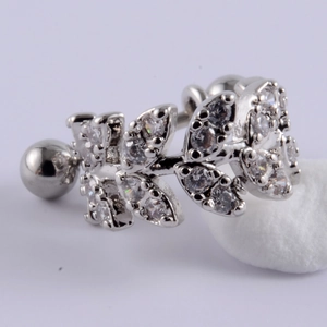 Macro detail of silver stainless steel leaf stud earring with cubic zirconia stones
