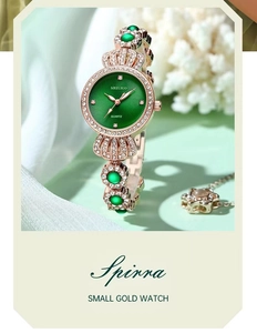 Detail of rose gold quartz watch with emerald green sunray dial and rhinestone bow strap