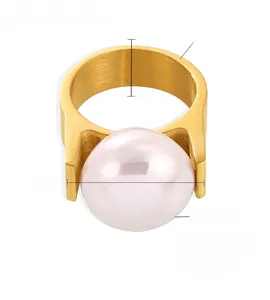 Detailed view of 18K gold plated ring with large shell bead and zircon stone inlay