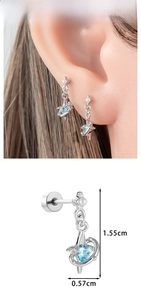 Macro detail of star and heart pendant earrings showing precise 1.55cm size dimensions