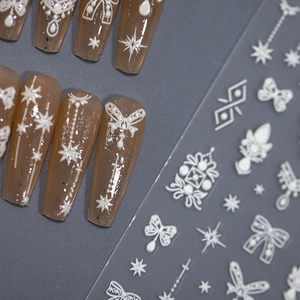 5D embossed white nail stickers with bow and pearl designs on jelly brown press-on nails