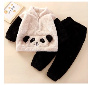 Detail of soft fleece texture and cute panda pocket on children's winter pajamas