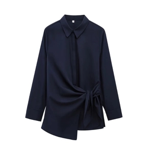 Detail view of navy blue poplin shirt with waist tie design and buttoned cuffs