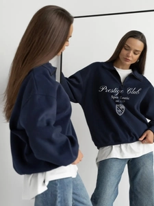 Mirror view of retro navy half-zip sweatshirt with Prestige Club graphic print