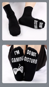 Detail of non-slip cotton gaming socks with I'M GAMING text and gamepad print