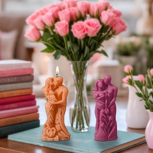 Macro shot of romantic couple embrace candle with intricate rose relief textures