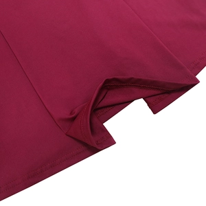Detail of burgundy sleeveless dress showing precise stitching and smooth fabric texture