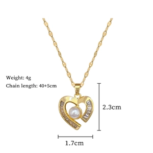 Detail showing gold heart necklace dimensions with white pearl and cubic zirconia stones