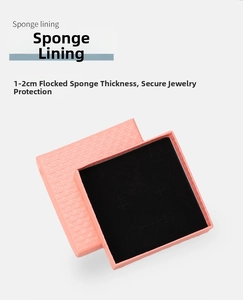 Pink diamond-textured jewelry box detail with 1-2cm thick black velvet sponge lining