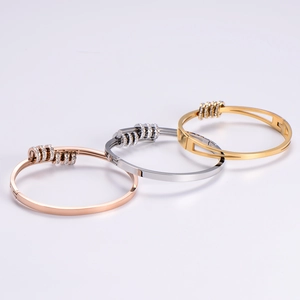 Elegant titanium steel open bangles in rose gold, silver, and gold with crystal accents