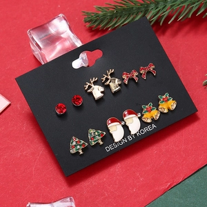 Detail of 6-pair Christmas stud earring set featuring reindeer, Santa, and tree motifs