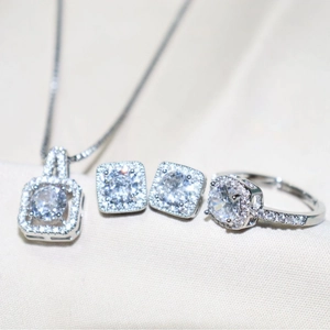 Silver jewelry set with square zircon pendant necklace, halo earrings, and open ring
