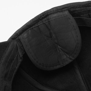 Detailed macro view of the inner lining and reinforced stitching of a wool earflap cap