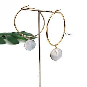 Minimalist 50mm gold stainless steel hoop earrings with natural black shell pendant