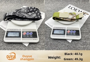 Canvas waist belt weight comparison showing silver D-ring buckle and floral patterns