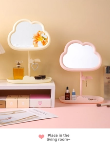 Detail of cloud-shaped makeup mirror with star hooks and integrated storage base tray
