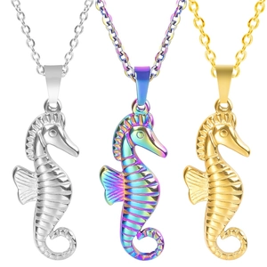 Three seahorse pendants in silver, rainbow, and 18k gold plated stainless steel