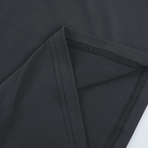 Macro shot of double-needle stitching and fabric texture on a slim-fit knit top