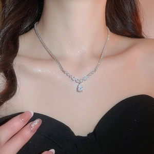 Detail of elegant teardrop pendant necklace with sparkling pavé cubic zirconia