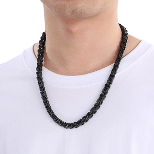 Close-up of black Byzantine chain necklace for men in stainless steel worn by a model