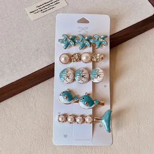 Detailed set of 5 blue ocean themed hair clips with starfish, shells and pearls