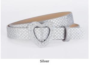 Detailed view of silver sequin belt with star patterns and a heart-shaped buckle