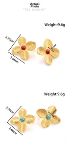 Detail showing petal textured flower earrings with red and green stone center beads
