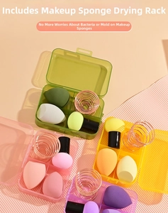 Macro shot of assorted makeup sponges with plastic storage boxes and rose gold drying racks