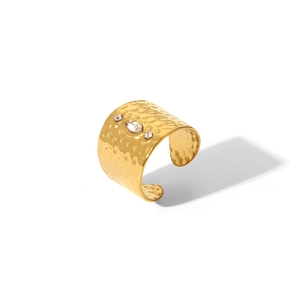 Detailed view of irregular gold hammer texture ring with marquise and round cubic zirconia