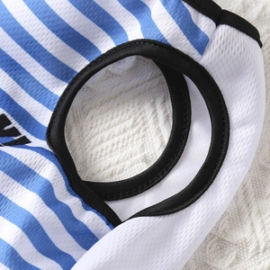 Close-up of blue and white striped pet vest with breathable mesh fabric and black piping