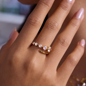 Gold plated stainless steel open ring featuring five sparkling zircon stones on finger