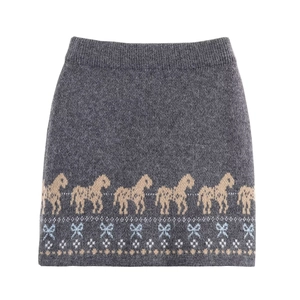 Knit mini skirt with grey base, brown horse jacquard, and blue bow accents in a flat lay