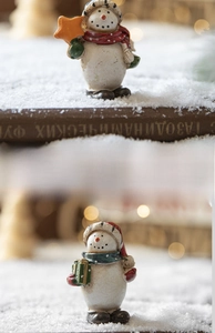 Detail of hand-painted resin snowmen with star and gift box for Christmas decor