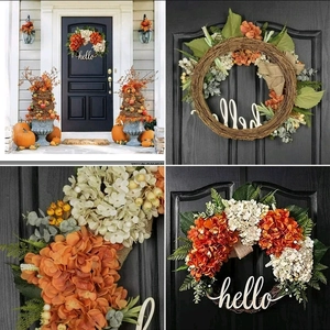 Fall hydrangea wreath with wooden hello sign and berries on grapevine base for front door
