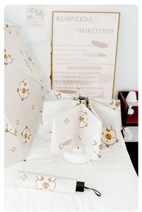 Detail of automatic capybara umbrella with cute star patterns in a cozy bedroom setting