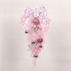 Detailed view of pink teardrop Christmas swag with ornaments and Merry Christmas sign