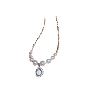 Elegant pearl necklace with light blue teardrop pendant and pavé zircon detailing