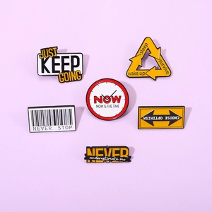 Detailed view of 6-piece metal enamel lapel pin set with inspirational English slogans