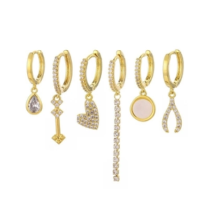 Detailed set of six gold-plated huggie earrings with cubic zirconia charms