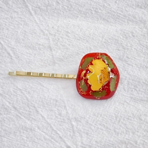 Handmade red resin hair clip with real yellow dried flowers and gold foil accents