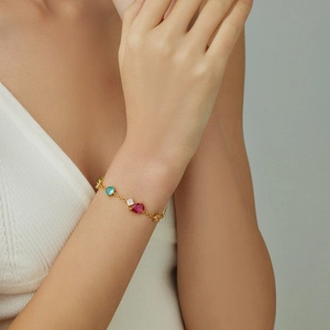 Exquisites goldfarbenes Armband mit lebhaften bunten Zirkonsteinen für Damen