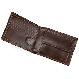 Detail view of genuine leather bifold wallet with card slots and a snap coin pocket