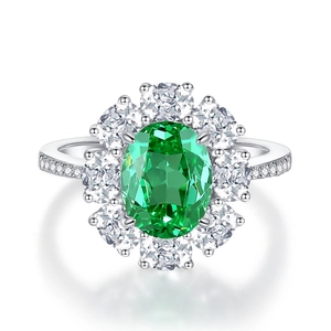 Elegant 925 silver halo ring with large oval green gemstone and pavé diamonds